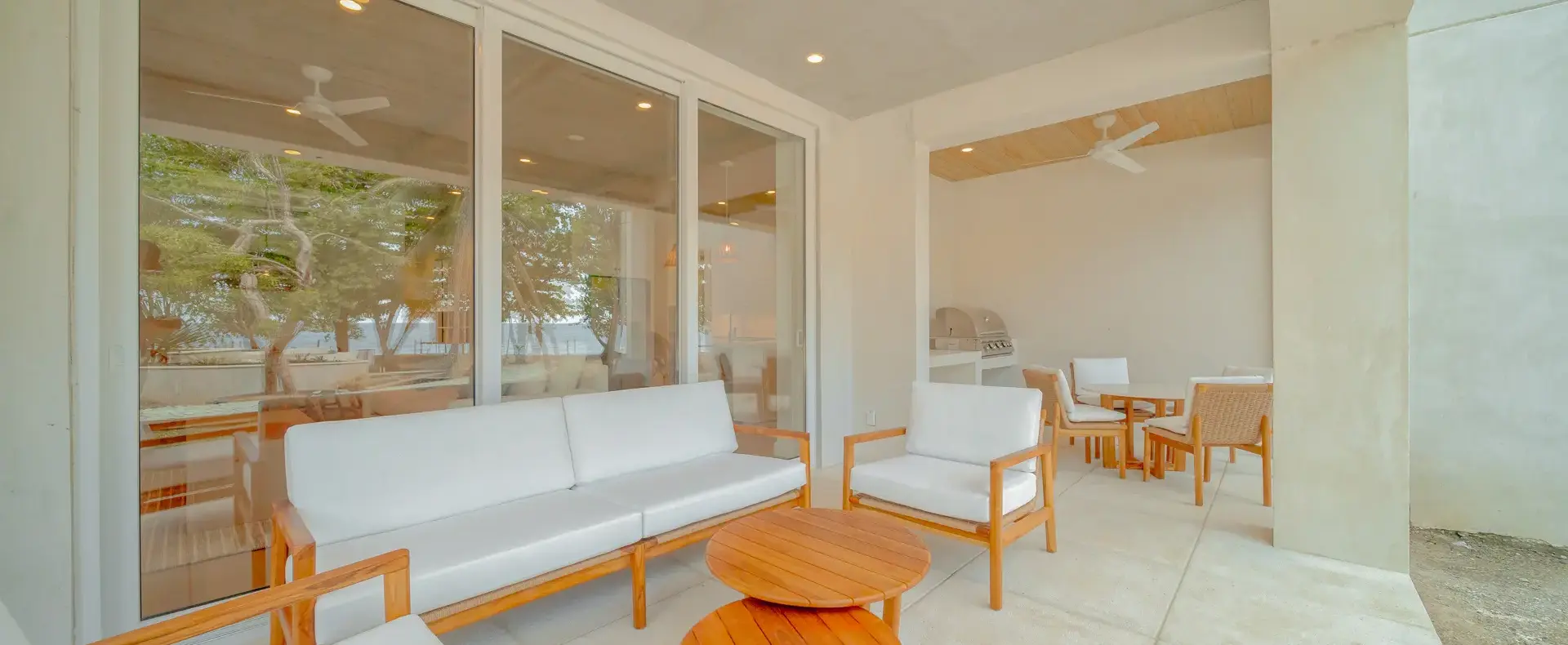 Covered terrace with outdoor furniture, Watercolors D4 condo, West Bay
