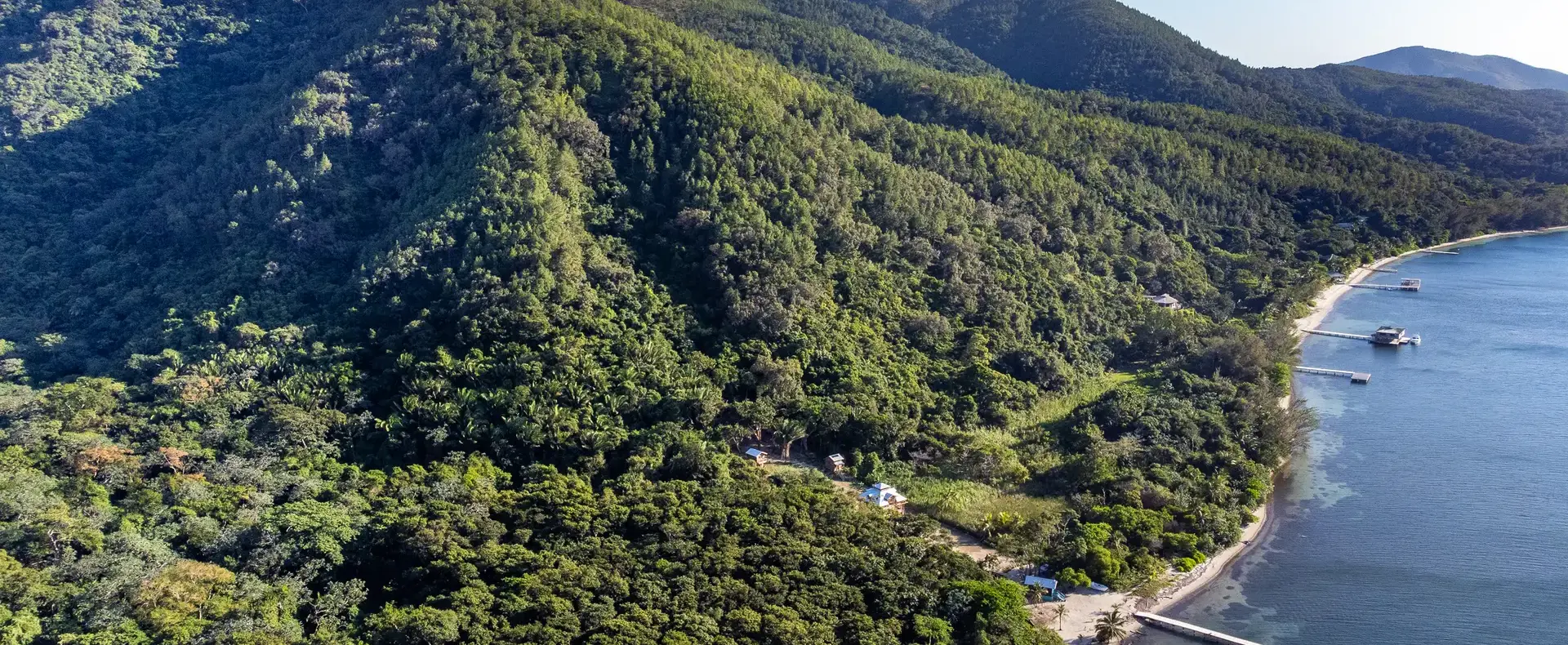 Aerial view of forested mountains and coast, 482-acre property, Guanaja