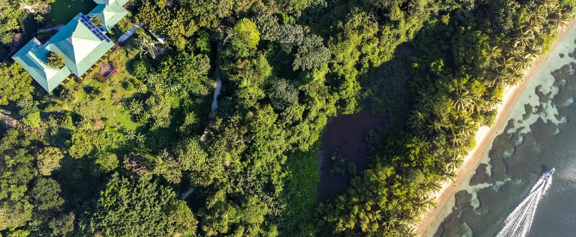 Aerial view of house in the forest by the beach, 482-acre property, Guanaja