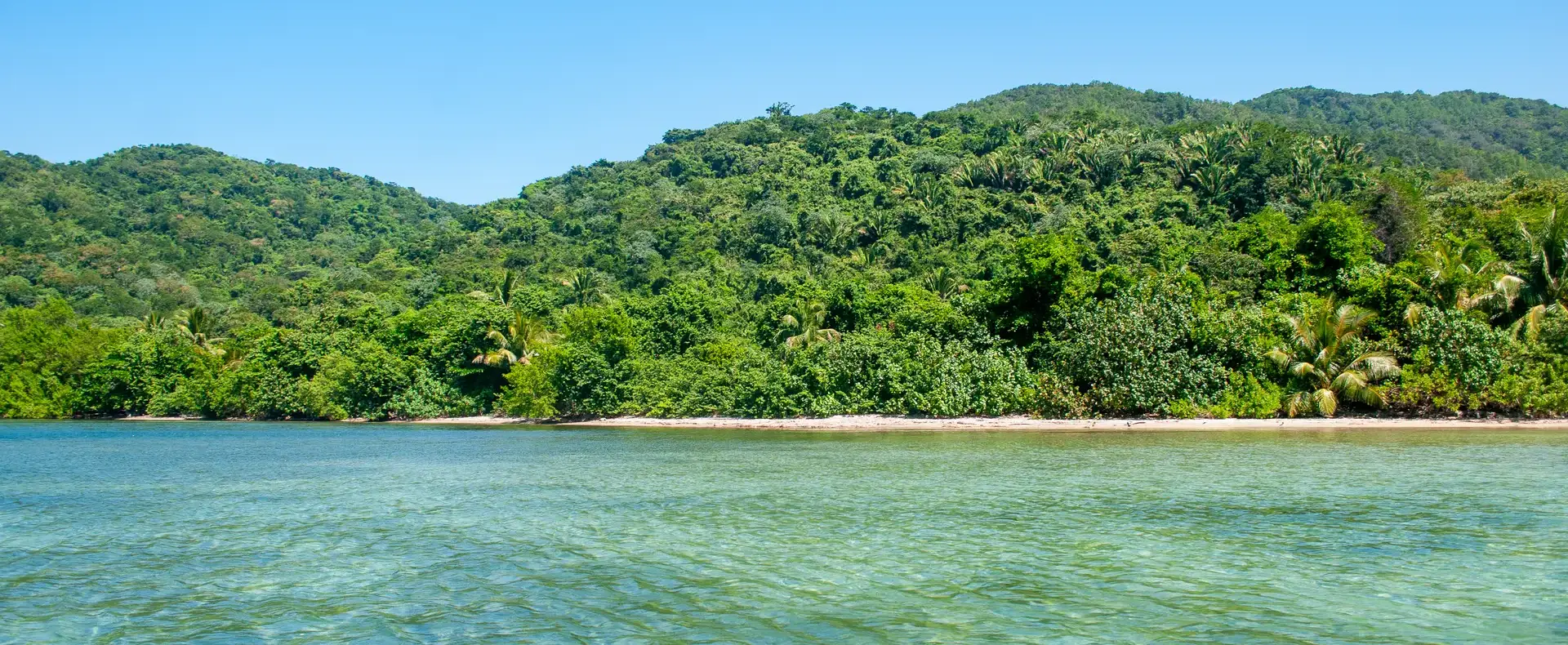 Clear shallow water and forested hills, 482-acre property, Guanaja