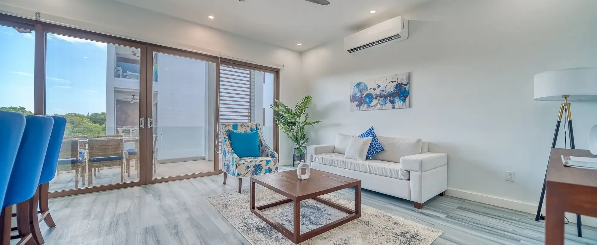 Living room opening onto the balcony, Acqua di Mare condo