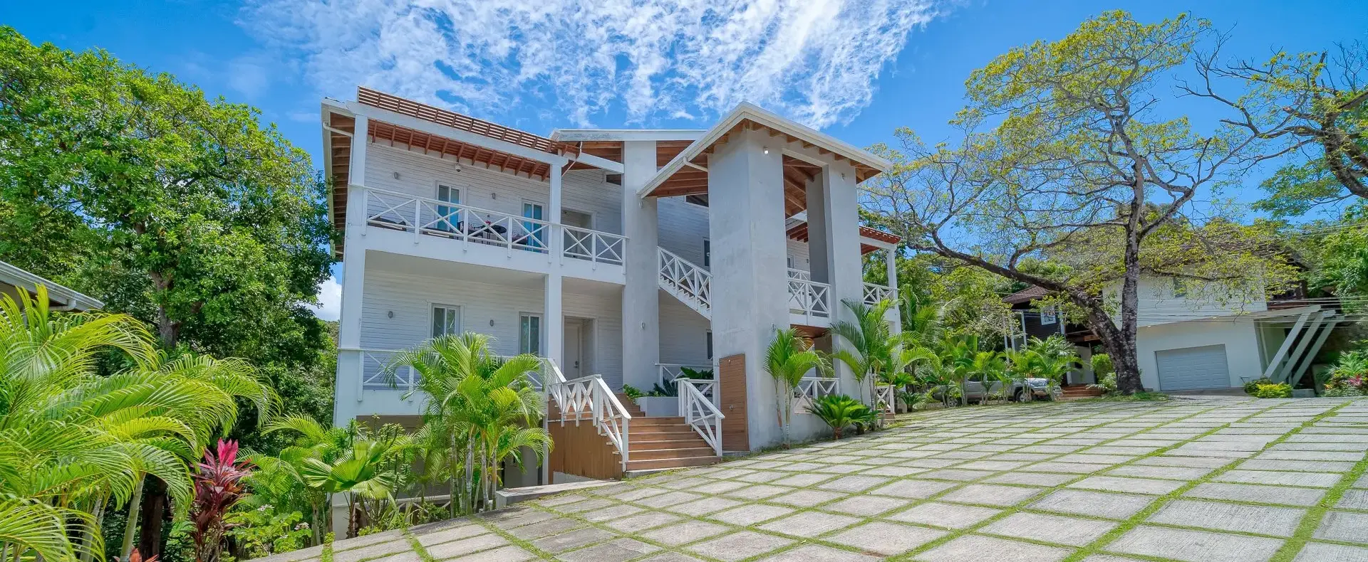 Blue Roatan Residence building with tropical garden