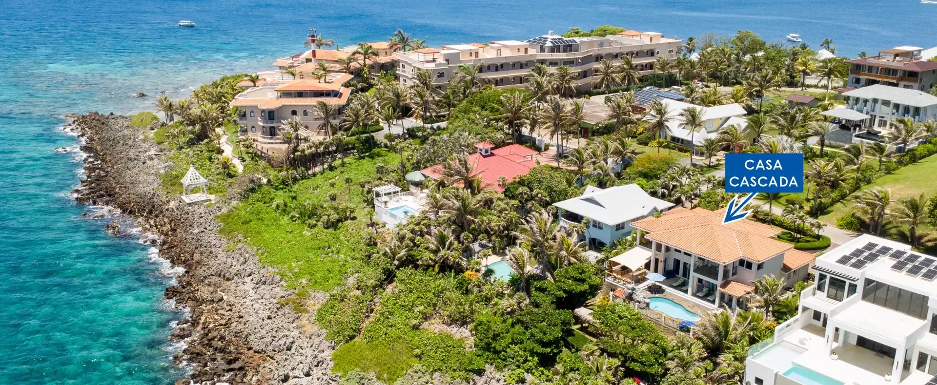 Aerial view of Casa Cascada on the oceanfront point of Lighthouse Estates, Roatan