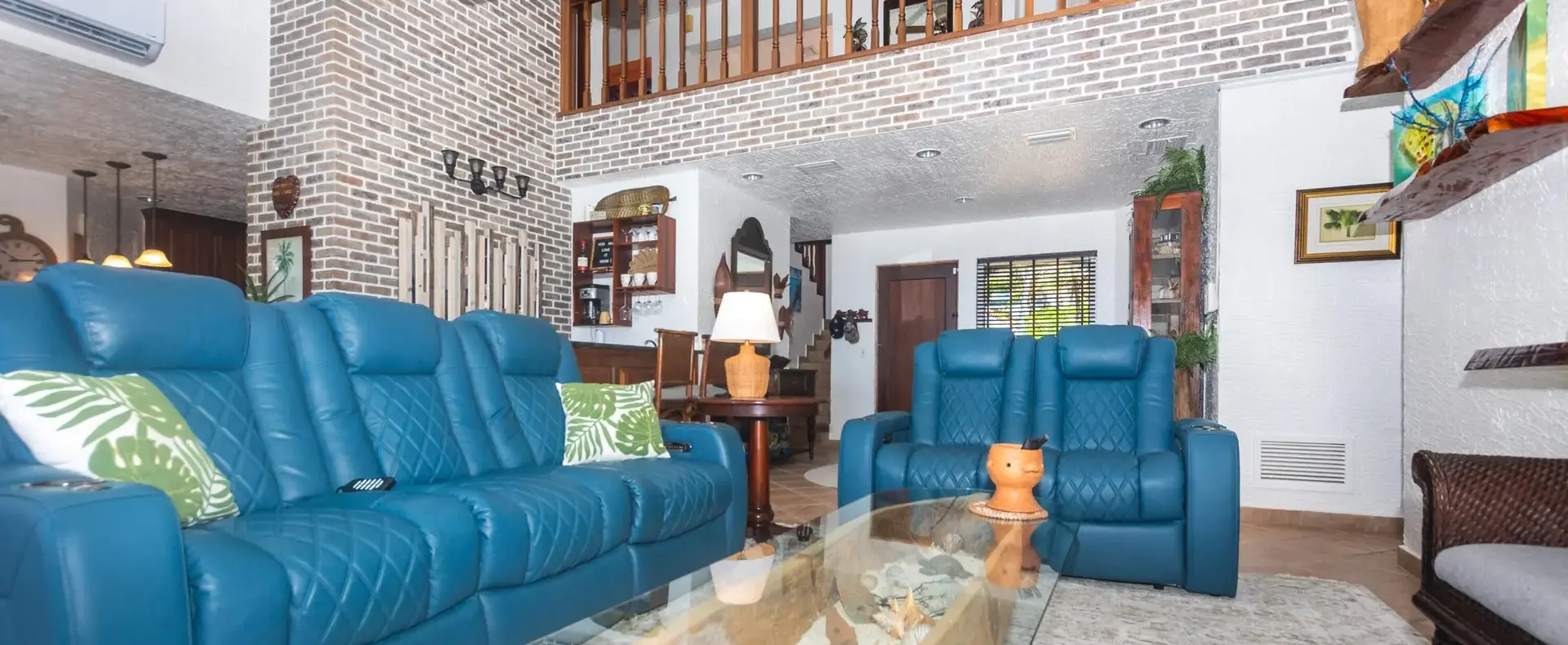 Double-height living room with upstairs loft railing