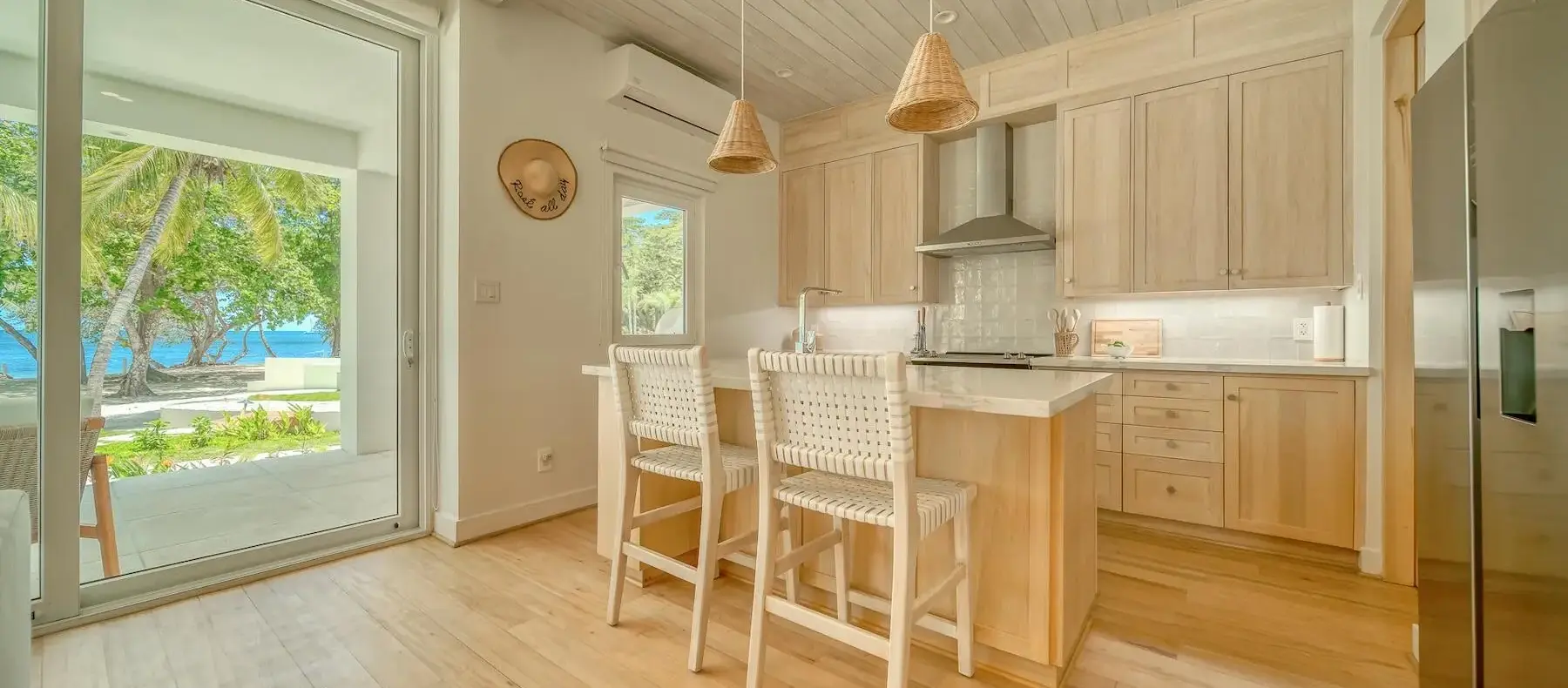 Kitchen with island and bar stools (sample unit)