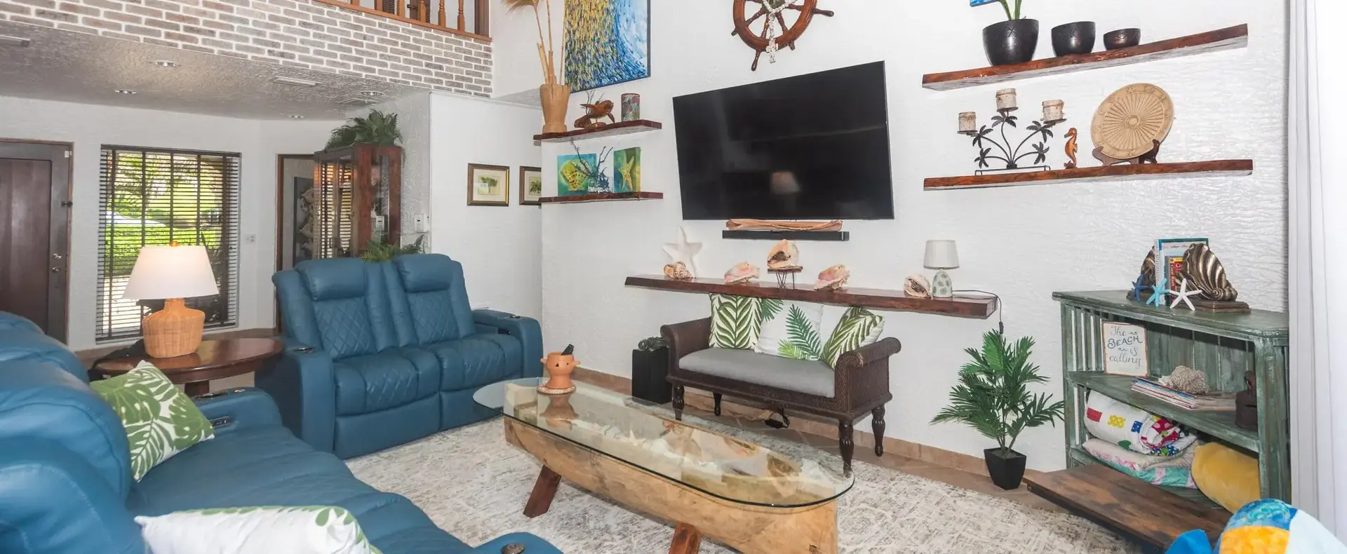 Living room with blue leather sofas and nautical decor