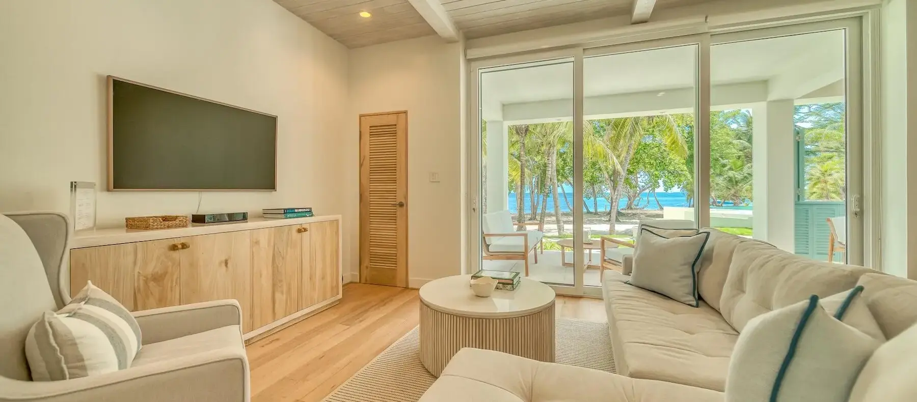 Living room opening to the terrace and ocean view (sample unit)