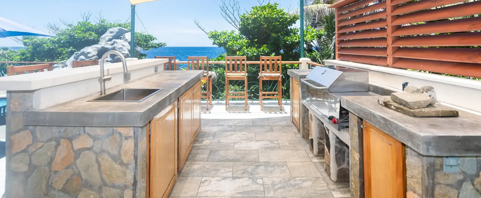 Outdoor kitchen and bar on the pool deck