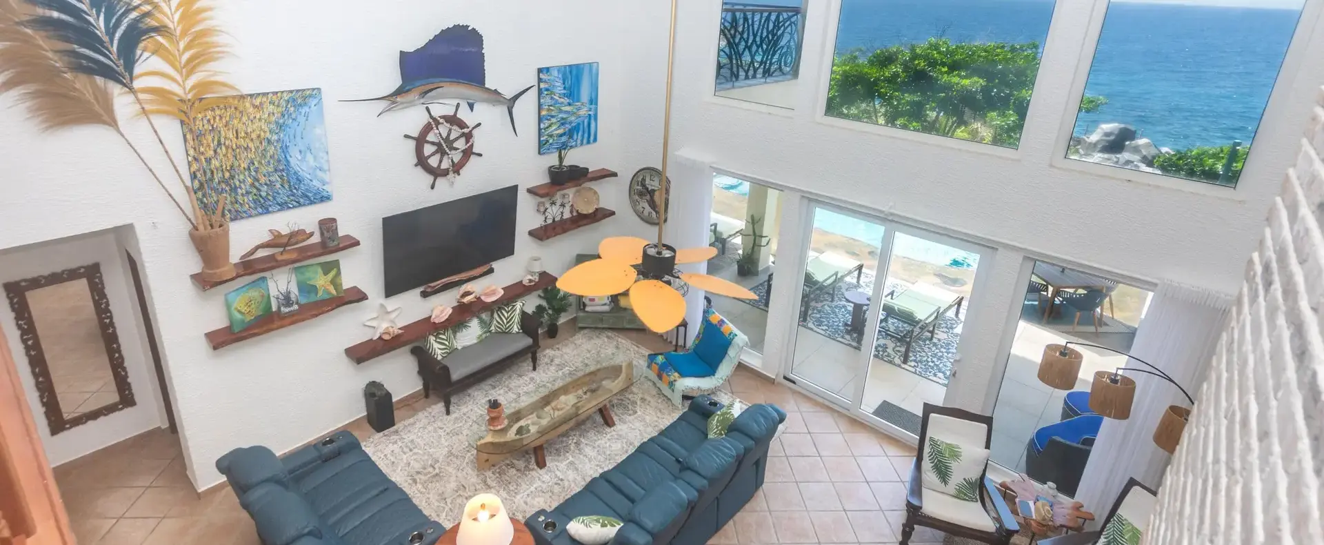 View from the upstairs sitting area over the living room to the ocean